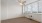 a room with a window and ceiling fan
